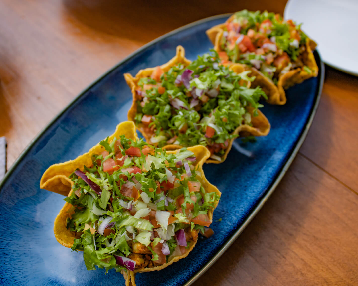 Fish Tacos on blue plate at Mercure Maldives Kooddoo