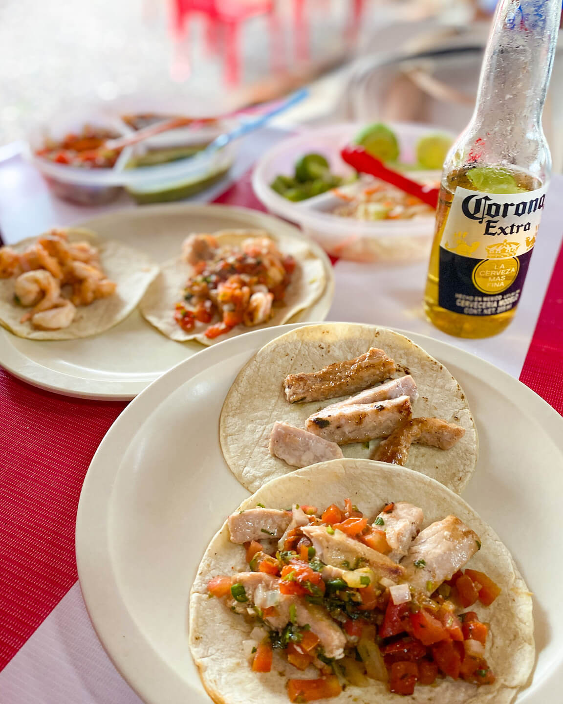 fish and shrimp tacos in Mexico with a bottle of beer