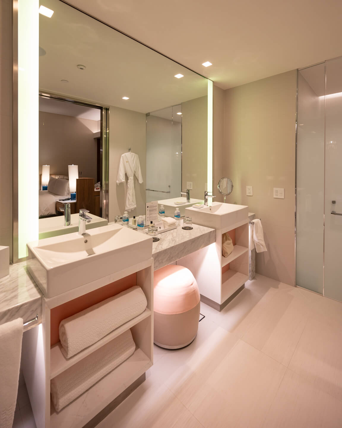bright bathroom with two sinks and marble