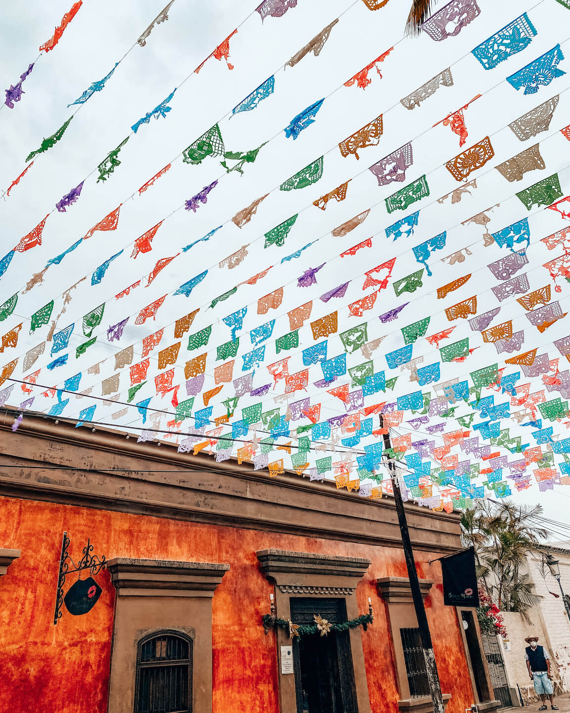 colorful flags hanging over street
